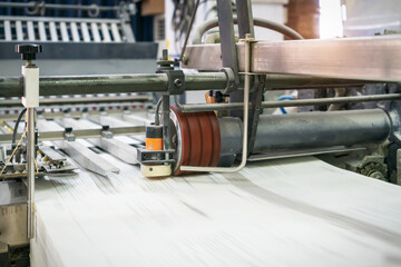 The offset press in the production process in the printing factory