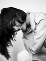 Fototapeta premium Monochrome portrait of a young smiling busyness woman. Happiness