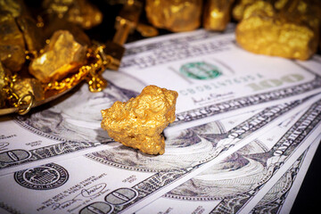 Close up of gold and US dollar, theme of financial concept