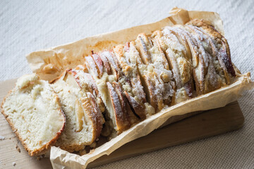 Apple cinnamon teabread cake on wooden board, selective focus