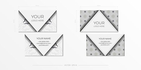 Vector Template for printing design business cards of white color with black ornament. Business card preparation with luxurious patterns.