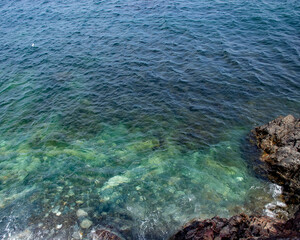 Looking down into the ocean's edge