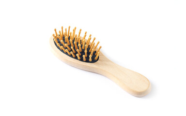 Wooden massage hair brush isolated on white background