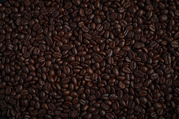 Coffee beans on dark background.