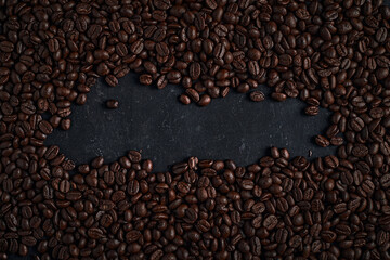 Coffee beans on dark background.