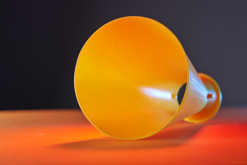 close up of megaphone on orange background