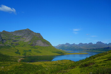 Dramatic mountain landscape on a hiking trail from Horseid beach to Kvalvika beach in Lofoten islands, Norway