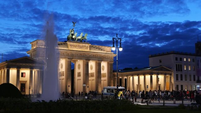 City of Berlin in Germany, Brandenburg Gate illuminated at night, famous Neoclassical style monument from 18th century.