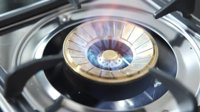 gas stove letting out of blue flame 