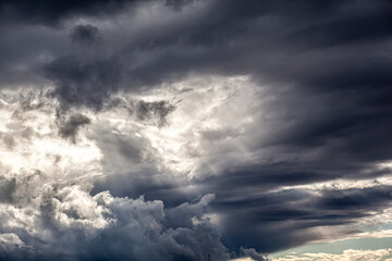 Dramatic sky with grey clouds over the city before the storm. Weather before or after a storm.