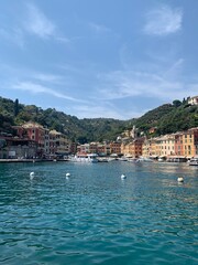 Skyline of Portofino village with colourful  houses and emerald water. It is famous holiday resort and fishing Italian riviera town. Portofino, Italy