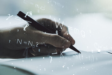 Creative scientific formula illustration with man hand writing in diary on background, science and...