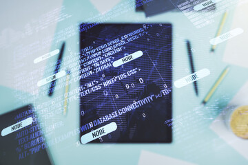 Multi exposure of abstract graphic coding sketch with world map and modern digital tablet on desktop on background, top view, big data and networking concept