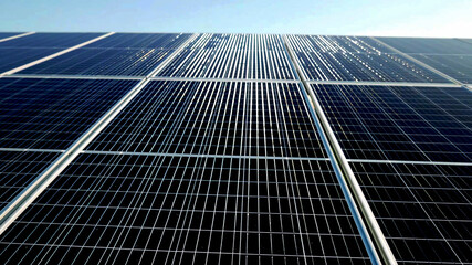 Solar power panel, sunlight reflection photovoltaic PV module solar energy plant farm close up background. - 452167382