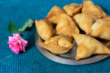 Homemade Samosa, samsa or smosa. A vegetarian spicy Indian special traditional street food. Iftaari dish, Selective focus.