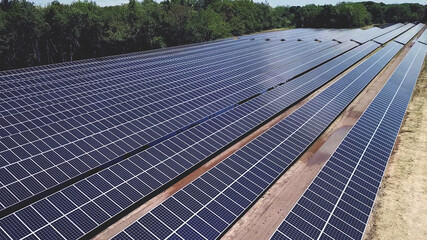 Drone high angle view of solar energy panels during sunny day. photovoltaic PV system in Solar array of a solar farm. - 452168110