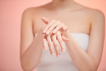 Obraz na płótnie Canvas Beautiful women hands isolate, applying cream, massaging