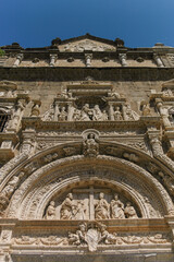 Old church entrance decoration with figures | Malaga, Spain