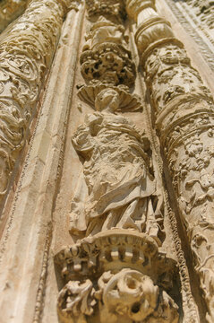 Old church entrance decoration with figures | Malaga, Spain