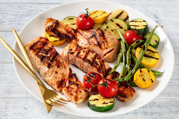 grilled salmon and vegetables on a plate