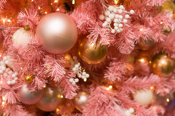 Fototapeta na wymiar Decorated christmas tree (new year) with many balls, toys and sparkles