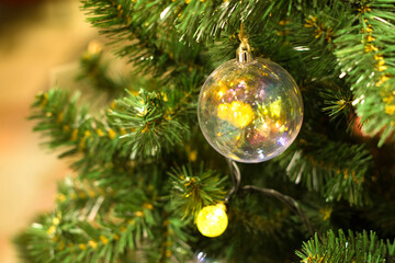 Decorated christmas tree (new year) with many balls, toys and sparkles