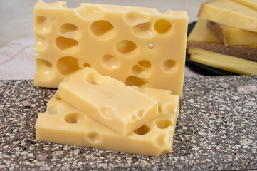 Cheese collection, semi-hard French cheese emmentaler with round holes made from cow milk