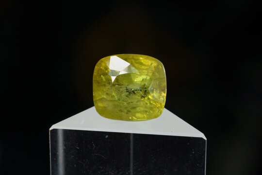 Natural gemstone sphene on black background
