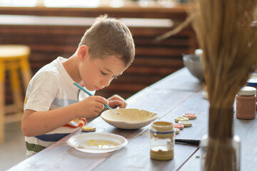 workshop for kids. Children learning how to use clay for making beautiful dishes. Workshop, master class.