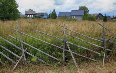 fence and grass in a village
