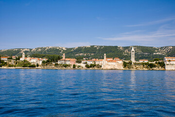 Fototapeta premium the famous church tower of rab view from the adriatic sea