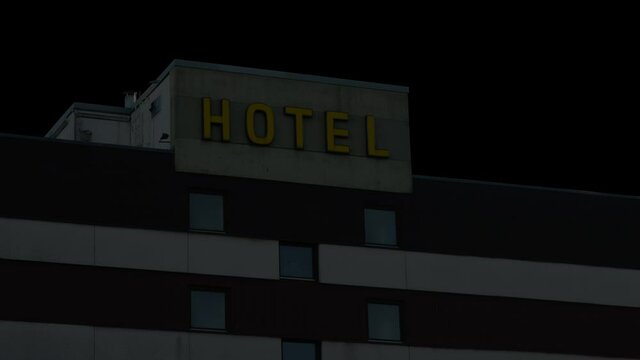 Looping Video Of A Neon Hotel Sign Turning On And Off