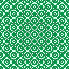 Seamless vector pattern with polka dots on fresh grass green background