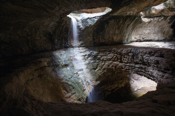 Fototapeta na wymiar Saltinsky, an underground waterfall in Dagestan - a natural landmark