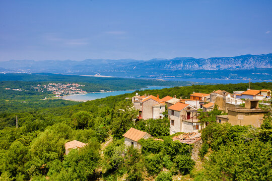 view to the bay of soline with mountains in background