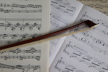 Fototapeta premium close up of a bow on musical scores 