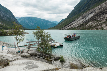 A ferry with tourists departing from the jetty