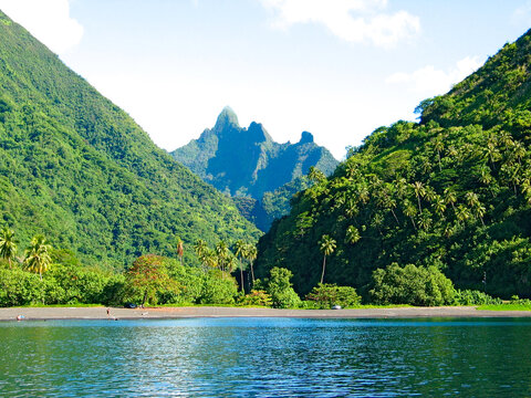Calm morning on a Tahiti black volcanic beach, Tahiti Iti, French Polynesia,Society Islands.
