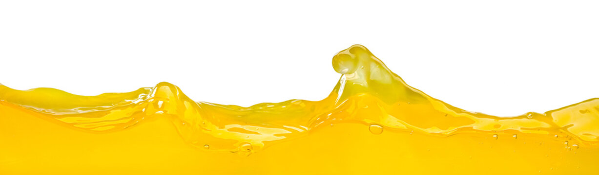 Orange juice waves splash, close up