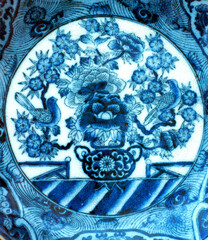 Blue painting on white porcelain plate.