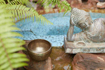 Tibetian bowl and statue of buddha 