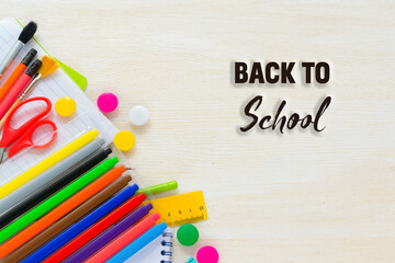 Back to school. Bright colorful school supplies for school or college on white background.Stationery for school children's studies. Greeting card or banner for sale. top view