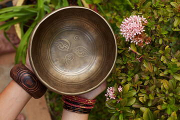 Tibetian bowl in a hands
