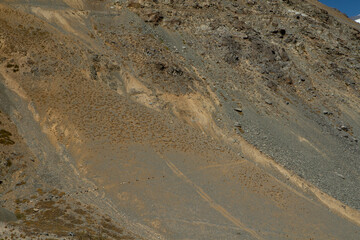 The arid mountains. Closeup view of the arid desert rock formation in the Andes cordillera. 