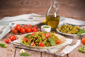 Fusilli pasta with cherry tomatoes and peas.
