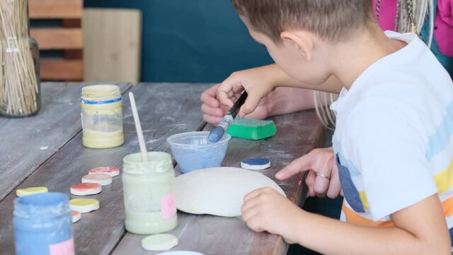 workshop for kids. Children learning how to use clay for making beautiful dishes. Workshop, master class.