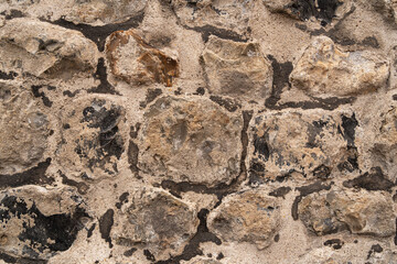 Close up of an old brick wall in Honfleur, France, for an abstract background texture.