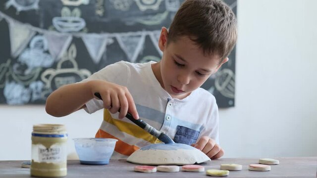 workshop for kids. Children learning how to use clay for making beautiful dishes. Workshop, master class.