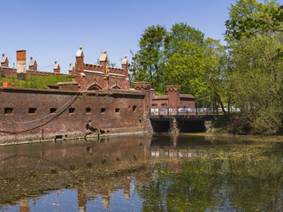 Friedlan Gate - one of the seven surviving city gates of Königsberg, 19th century. Inner side and water moat. Russia, Kaliningrad - 452200940