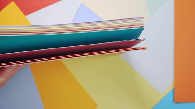 Leafing through ream of colored paper.mov
